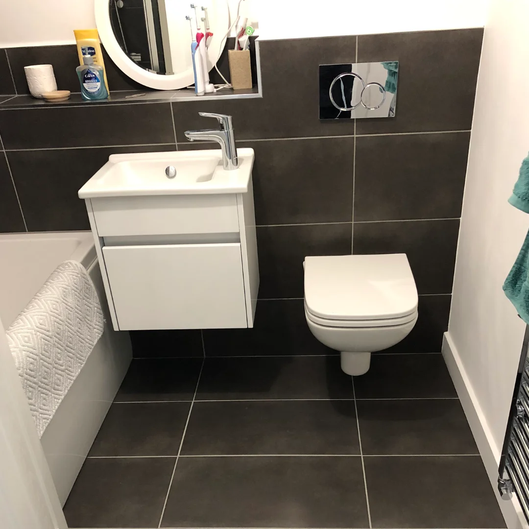 Black tiles with White Sink and White W/C