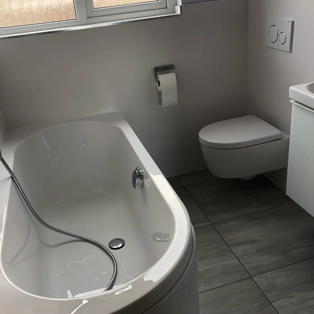 Bathroom renovation with grey flooring tiles
